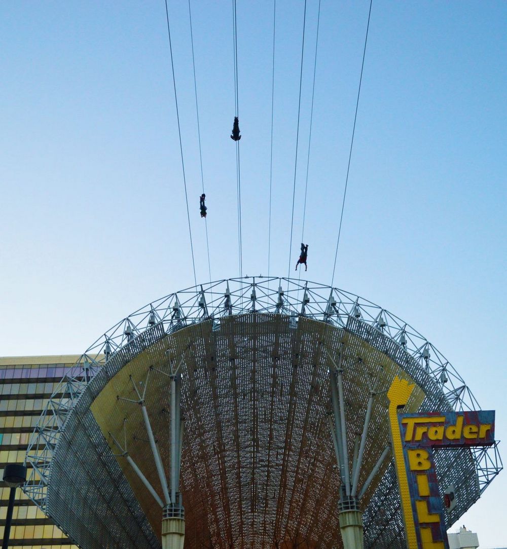 Zoomline riders soar over FSE from Slotzilla at Fremont Street Experience Las Vegas